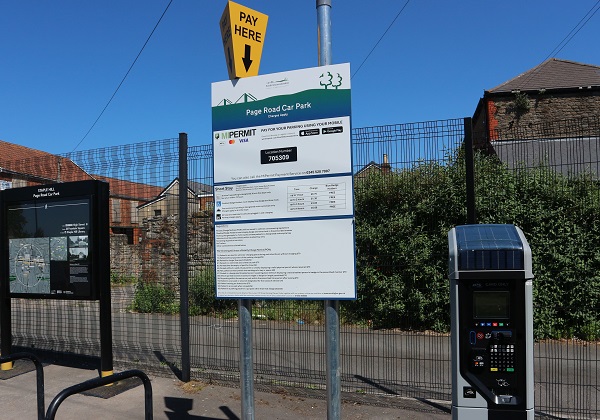 Car park charging sign and payment machine in Page Road car park, Staple Hill