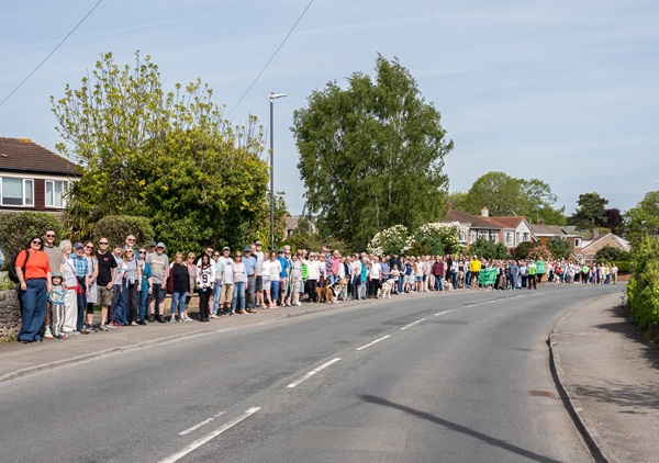 Residents opposed to the plan line Hicks Common Road overlooking the site. Picture: Simon Goodwin.